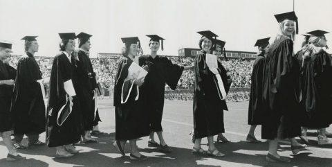 women in cap and gown