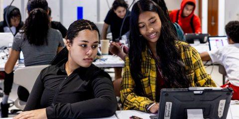 students looking at a laptop